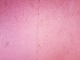 Pink plywood texture during the construction of a residential building in Russia. Eco-friendly materials.