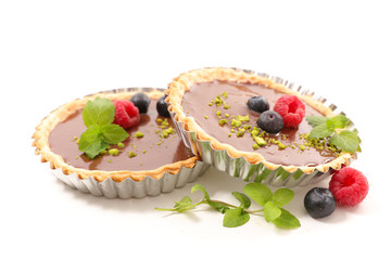 delicious chocolate tart and berry fruit on white background