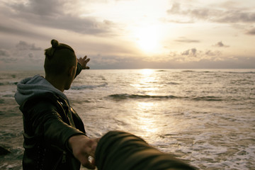 Obraz premium Holidays and vacations. Two guys at the sea. 