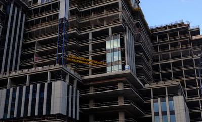 A multi-storey building under construction, shot from the bottom up at an acute angle