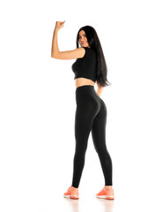 young and happy sporty woman showing her biceps