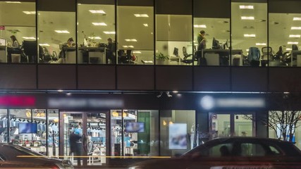  office workers  at the end of working day, time lapse - Powered by Adobe