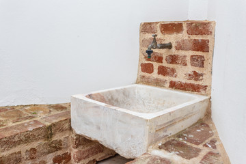 Vintage marble square washbasin on the outdor.