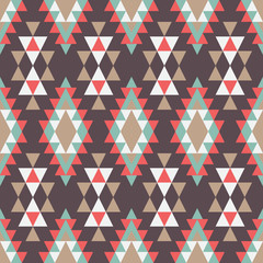 Geometric ornament of rhombuses and triangles in the native American style. Seamless vector pattern for web, print, textile, wallpaper, card, wrapping paper and background