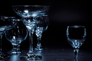 Empty  glasses for drinks on dark background