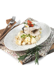 food photography of lunch diet dish, mashed potatoes with steamed fish, with lemon and herbs on a white background isolated close up