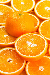Background from fresh orange slices. Side view.