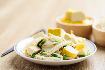 Stir fried mung bean sprouts with tofu, Asian vegan food	