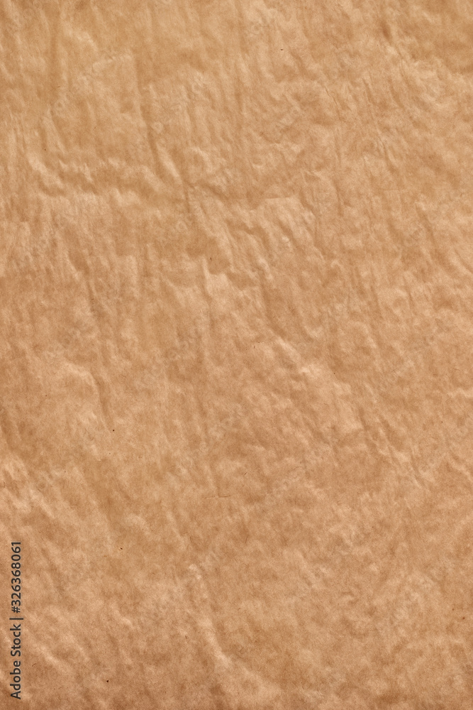 Wall mural vertically oriented crumpled baking paper with smooth curves. abstract culinary cooking texture back