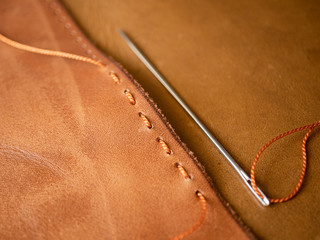 Genuine Leather. Sewing a purse. Leather work. Tools for sewing bags, wallets, clutches. Stitching....