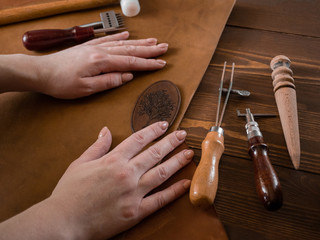 Genuine Leather. Sewing a purse. Leather work. Tools for sewing bags, wallets, clutches. Stitching....