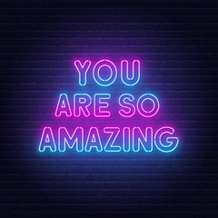 Fototapeta na wymiar You are so amazing neon lettering. Neon sign on brick wall background.