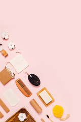 Eco-friendly accessories for women's body care on pink background. Flat lay, top view, copy space.