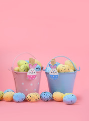 Happy Easter. bunny toy and egg in  bucket, on pink background. Easter holiday concept, spring season. minimal decor. copy space