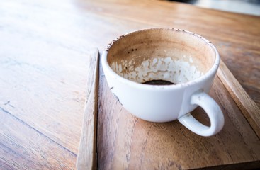 Finished Empty coffee cup on the wooden table