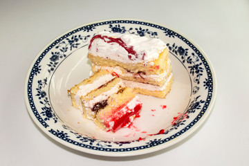 Homemade puff cake, cake in a plate, sponge cake.