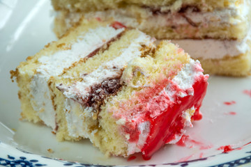 Homemade puff cake, cake in a plate, sponge cake.