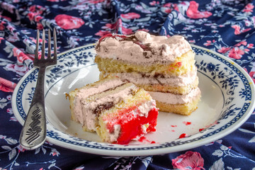 Homemade puff cake, cake in a plate, sponge cake.