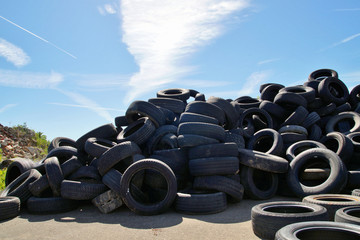 Tires Heap - Used old Tyres Many car and truck tires on dump site. Ecology background or texture...