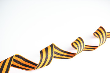 St. George ribbon - Russian symbol of victory in the second world war on a white background. Space...