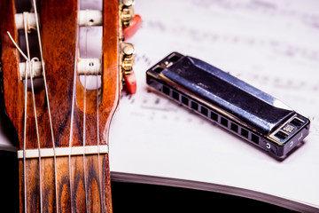 guitar and harmonica with notes