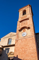 Obraz premium Bettona, village in Umbria of Etruscan origins, Italy. Close to Assisi, it rises on the Martani mountains on the banks of the Tiber river. Facade and bell tower of the Church of 