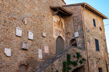 Fototapeta na wymiar Bettona, village in Umbria of Etruscan origins, Italy. Close to Assisi, it rises on the banks of the Tiber river. Medieval building connected to the historical museum of the village.