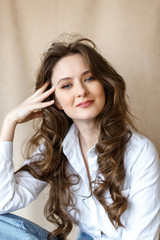 Fototapeta premium Portrait of a beautiful brunette woman in office clothes. Business woman concept