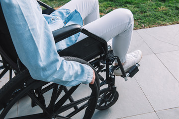 Person using wheelchair on street.Disable concept