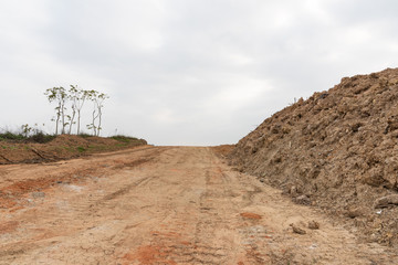 Dirt uphill road and muck pile