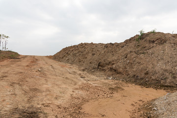 Dirt uphill road and muck pile