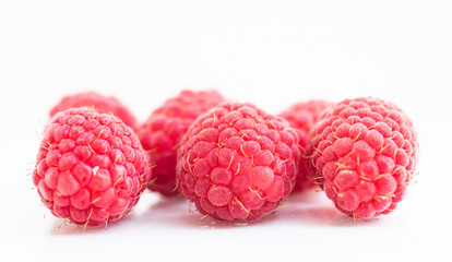 Close up raspberry on white background.