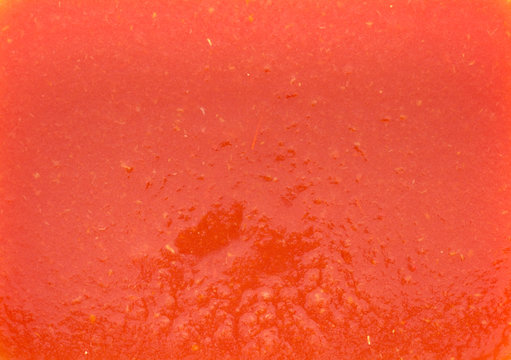 The Texture Of The Tomato Juice With The Pulp In A Rectangular Shape. Red Is A Warm Tone With A Barely Orange Tinge.