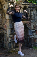 portrait of young woman streching muscles in a castle