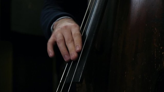 Close up shot of violist hands playing live on synth 