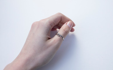 Woman's holding a White Gold Ring.Broken Engagement Ring