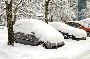 Moscow - Parked cars in the snow, heavy snowfall covered the city with snow.