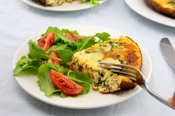 Frittata made of eggs, bacon, cheese and spinach