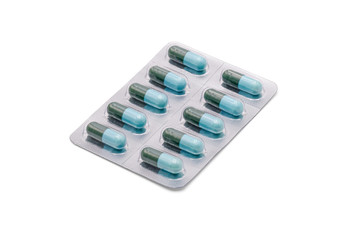 Close up on tablets and capsules pill in blister packaging arranged on white background, Pharmaceutical industry concept. Pharmacy drugstore, Amoxicillin capsule pills.
