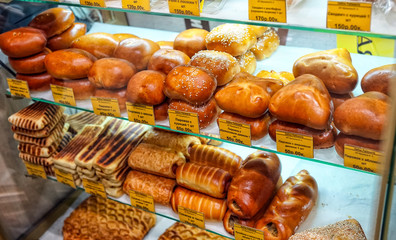  Dough pastries with filling on the counter, in a pastry shop.