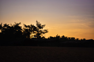 a beautiful yellowish sunset in goa beach