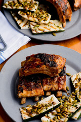 Pork BBQ Ribs. Tradtional Classic barbecue staple. Pork ribs seasoned with a dry rub and slow cooked in a smoker over mesquite wood chips and covered in bbq sauce. 