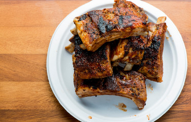Pork BBQ Ribs. Tradtional Classic barbecue staple. Pork ribs seasoned with a dry rub and slow cooked in a smoker over mesquite wood chips and covered in bbq sauce. 
