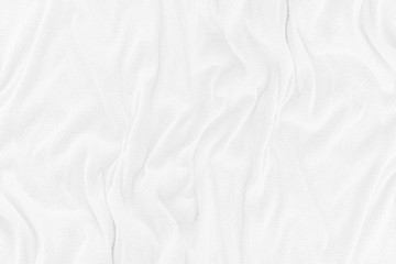Fototapeta na wymiar White cloth texture with soft waves. crumpled fabric background.