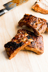 Pork BBQ Ribs. Tradtional Classic barbecue staple. Pork ribs seasoned with a dry rub and slow cooked in a smoker over mesquite wood chips and covered in bbq sauce. 