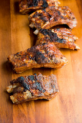 Pork BBQ Ribs. Tradtional Classic barbecue staple. Pork ribs seasoned with a dry rub and slow cooked in a smoker over mesquite wood chips and covered in bbq sauce. 