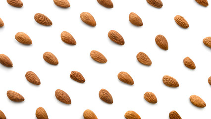 Almonds nuts isolated on white background. Flat lay pattern of roasted almond.