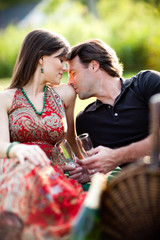 Young Couple Enjoying Picnic Together Outside