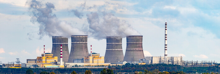 Nuclear power plant panorama with two RBMK type reactors, same as Chernobyl type, and cooling...