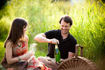 Young Couple Enjoying Picnic Together Outside